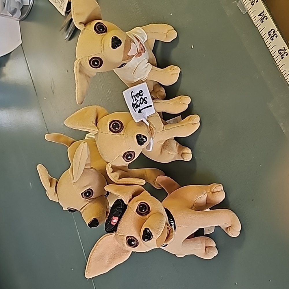 4 Tocco Bell dogs. Very good used condition Adorable little guys.